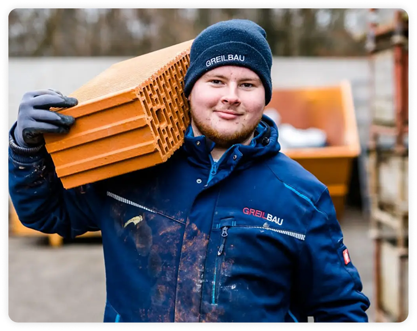 Greilbau Mitarbeiter auf der Baustelle mit Baumaterial